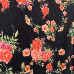 It’s a knee long black with pink flowers